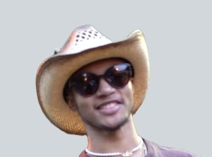 Trent Tate, professional natural hair specialist at Nappy Hutt LLC, in a professional headshot. 